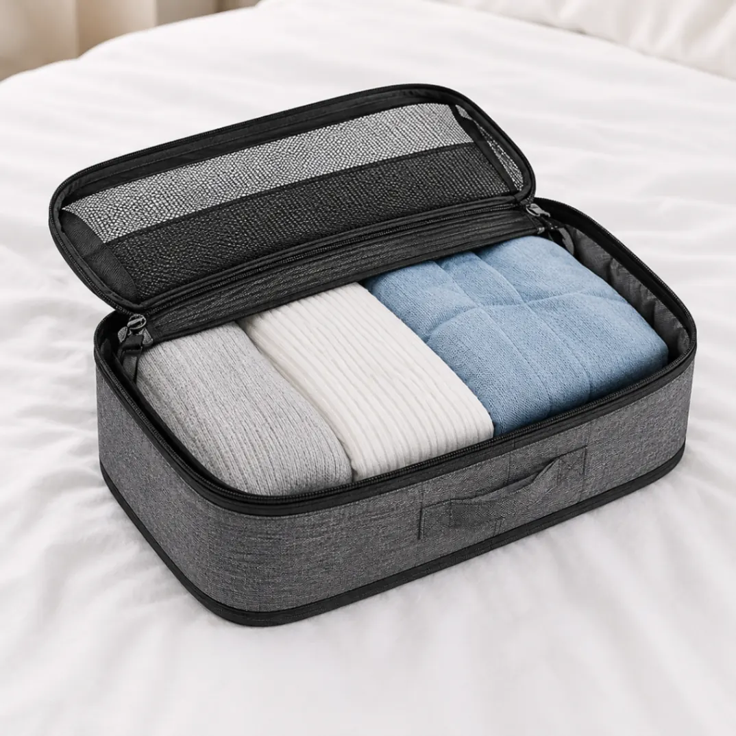 Detail of an open packing cube with folded clothes and its mesh lid