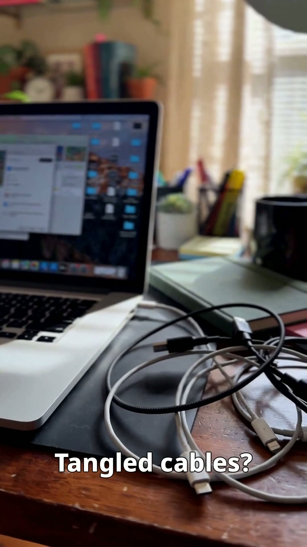 Cable organizer clips holding charging cables neatly on a desk