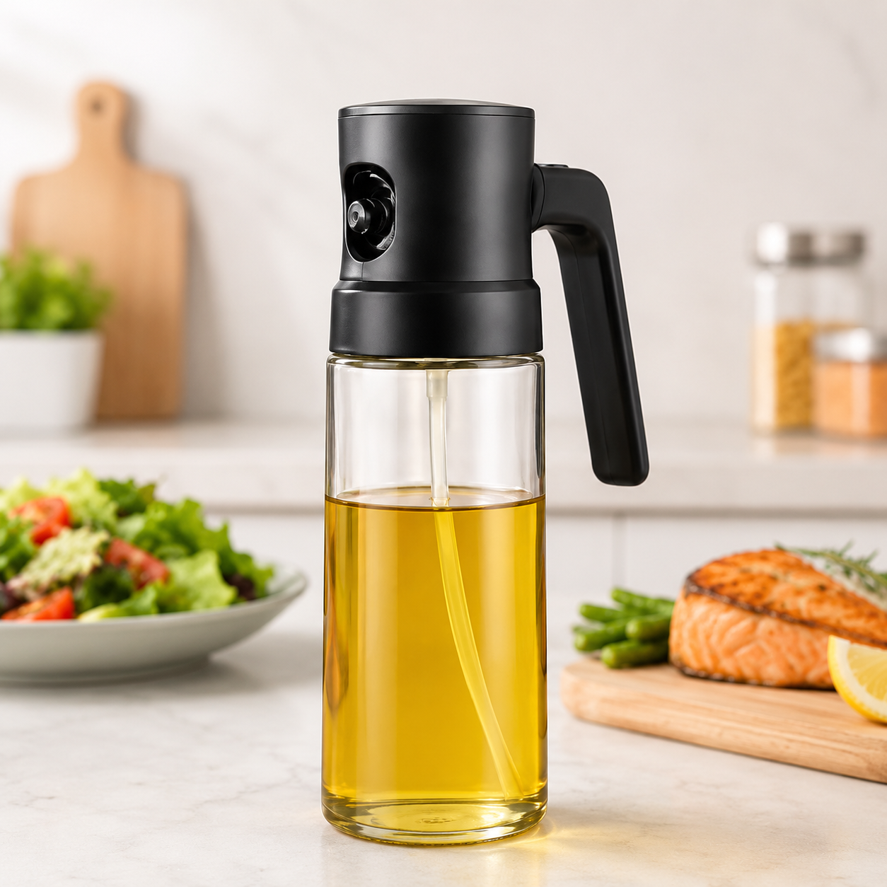 Black 2-in-1 oil sprayer and dispenser bottle on a kitchen counter