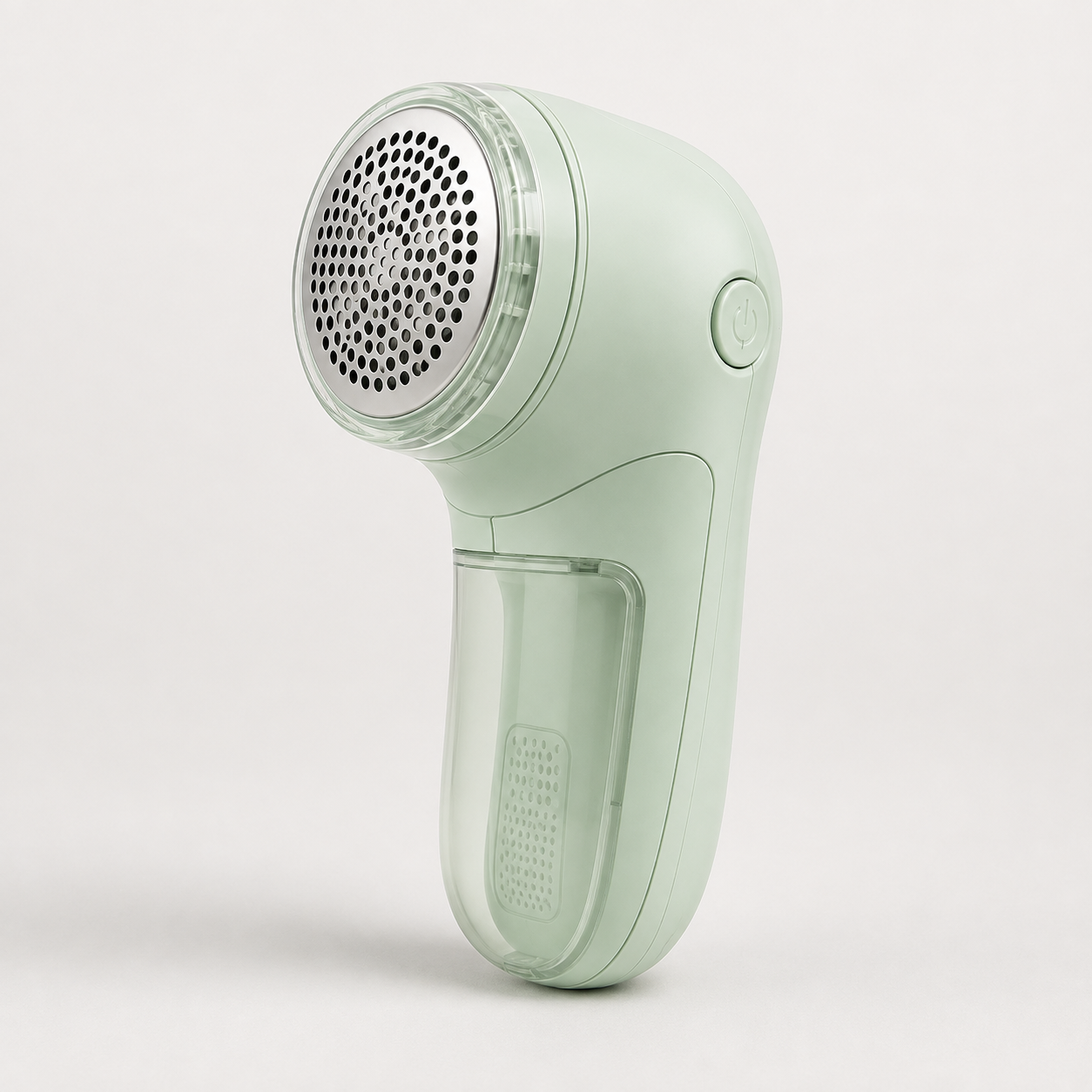 Green fabric shaver shown on a plain background with its lint chamber